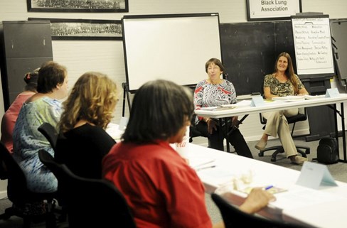 Linda Stein, left, and Sue Slater lead a diabetes management class Monday at the New River Health Clinic in Scarbro. (Chris Jackson/The Register-Herald)