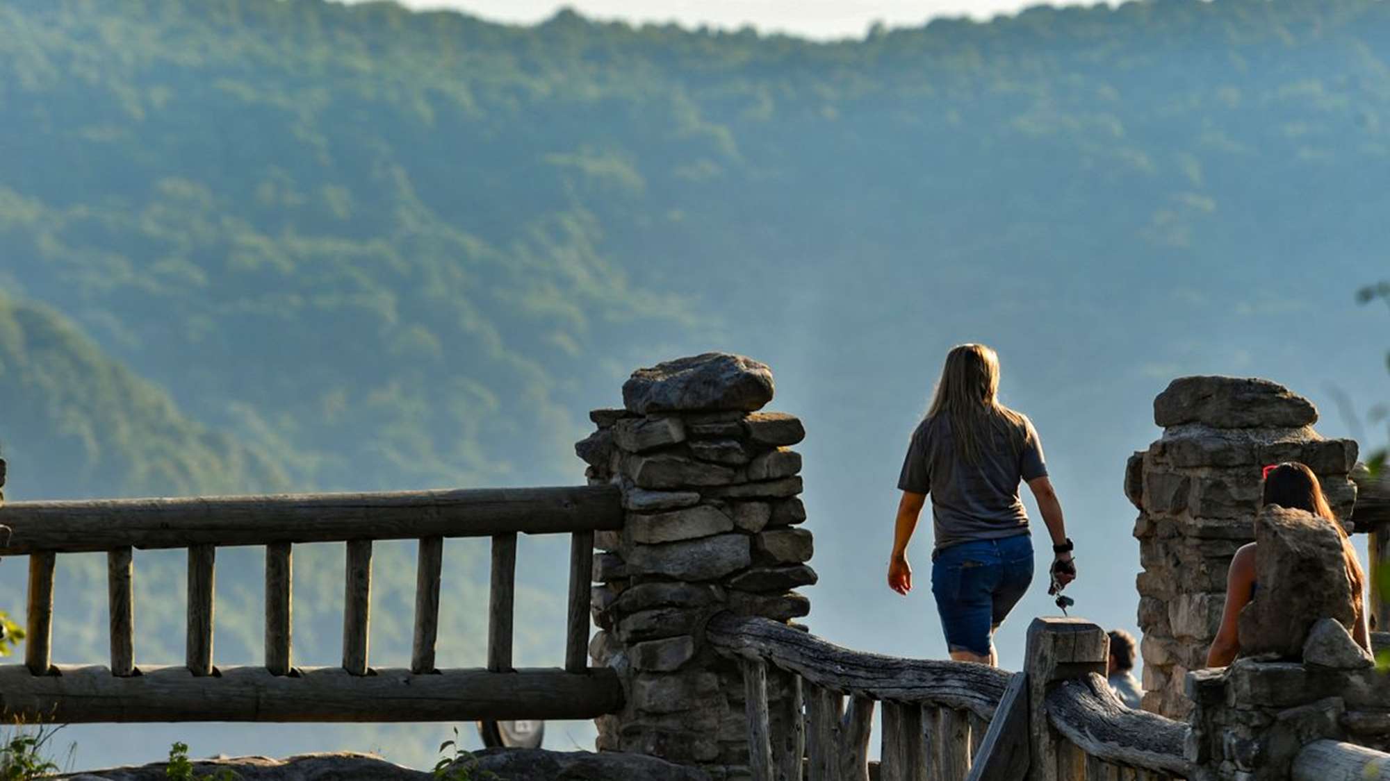 Two women walk to the Cooper's Rock Overlook  