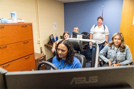 A group of students using the desktop simulator.
